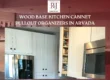 Wood base pullout cabinet organizers in a modern Arvada kitchen with white cabinets and stainless steel appliances